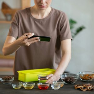 young-craftswoman-with-smartphone-shooting-bowls-c-2021-09-24-03-21-08-utc